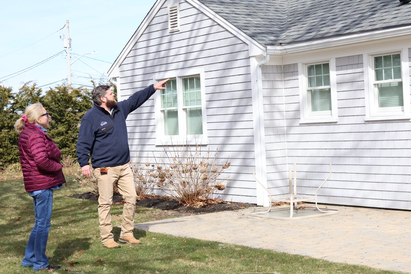 Cape Cod Exteriors founder consulting with homeowner