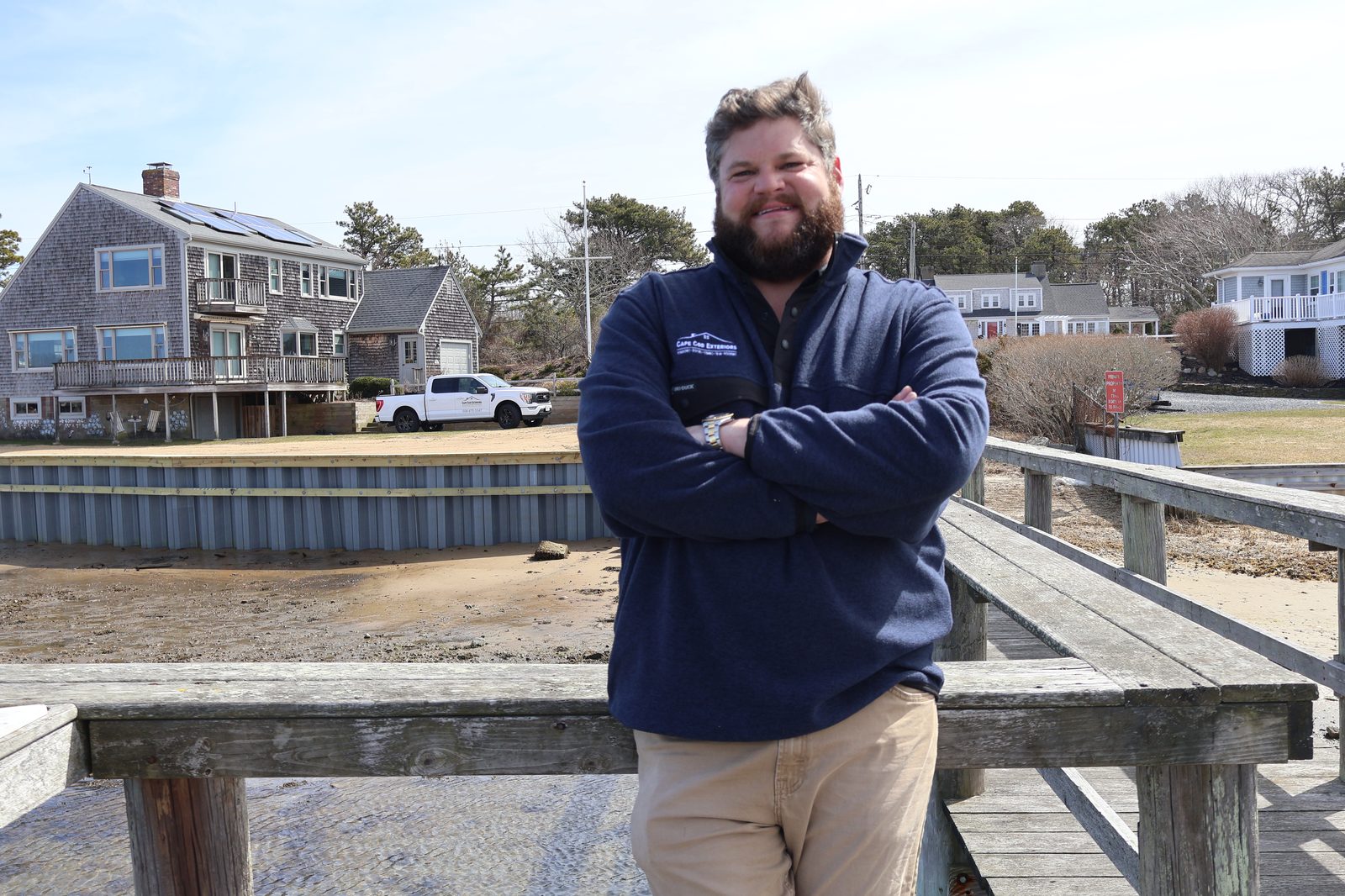 Andrew Bass, Cape Cod Exteriors founder, on waterfront dock